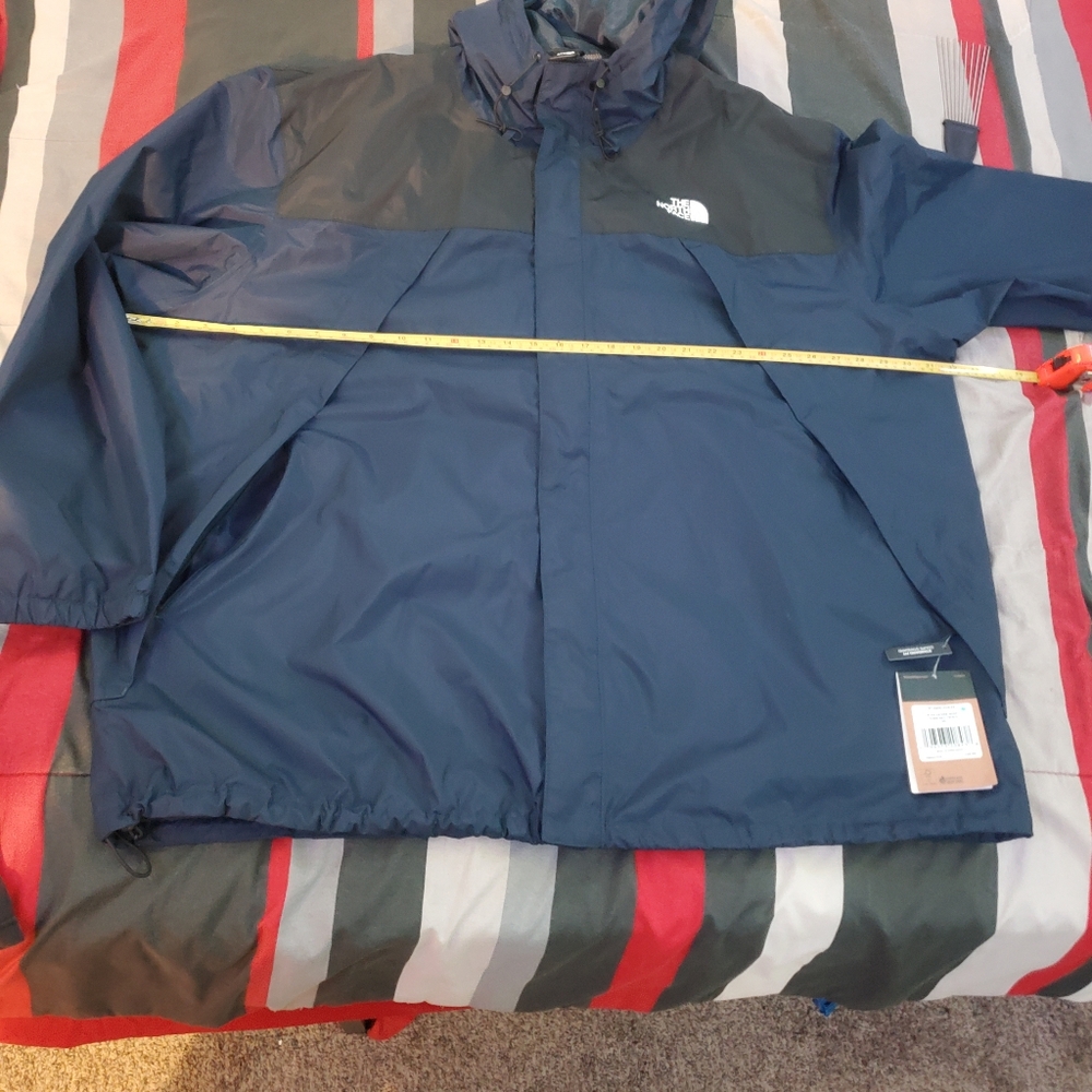 The North Face Blue Windbreaker with Weather-Resistant Fabric